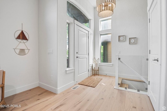 5521 N Freestyle Way, Park City, UT 84098 - entryway featuring wood finished floors, baseboards, and a chandelier