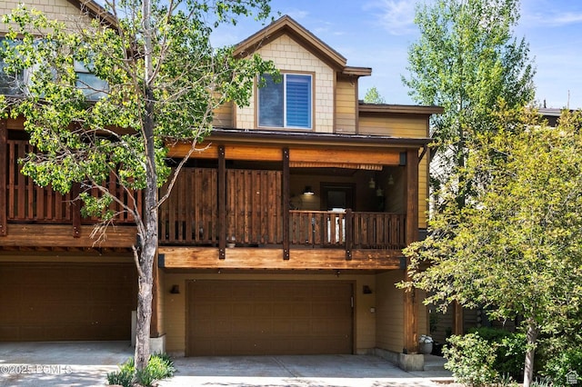 5521 N Freestyle Way, Park City, UT 84098 - back of house featuring an attached garage and driveway