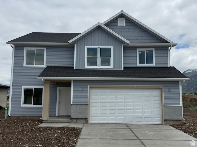 3298 S 1000 W, Nibley, UT 84321 - view of front of house with driveway and a garage