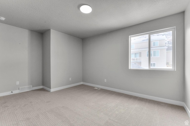 1470 N Shadow Wood Dr, Kaysville, UT 84037 - empty room with light carpet, baseboards, and a textured ceiling
