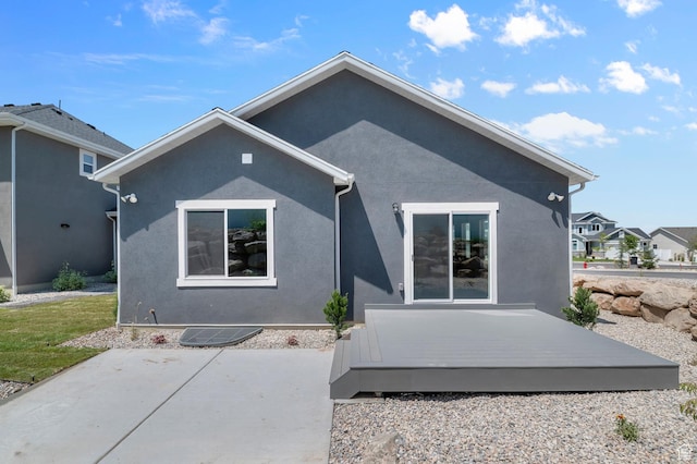 1470 N Shadow Wood Dr, Kaysville, UT 84037 - rear view of house featuring a patio area, a wooden deck, and stucco siding