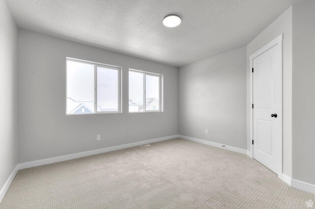 1470 N Shadow Wood Dr, Kaysville, UT 84037 - carpeted spare room featuring a textured ceiling and baseboards