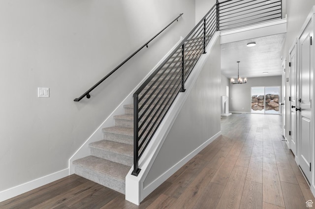 1470 N Shadow Wood Dr, Kaysville, UT 84037 - staircase featuring a chandelier, baseboards, and hardwood / wood-style floors