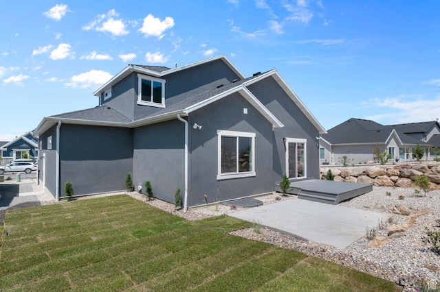1470 N Shadow Wood Dr, Kaysville, UT 84037 - rear view of house featuring stucco siding, a patio, and a yard