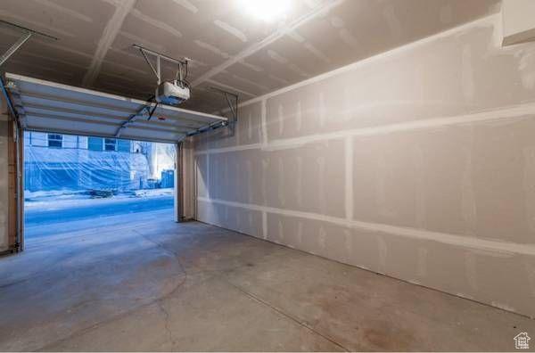14474 Renner Ln Unit 302, Herriman, UT 84096 - garage featuring a garage door opener