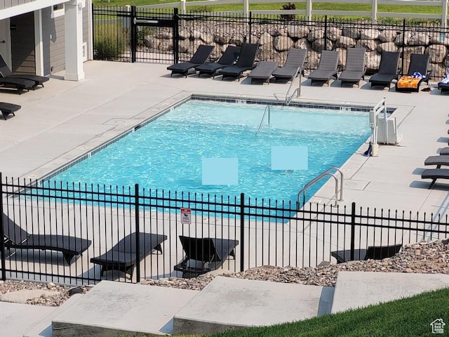 14474 Renner Ln Unit 302, Herriman, UT 84096 - community pool featuring a patio