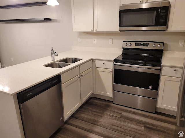 14474 Renner Ln Unit 302, Herriman, UT 84096 - kitchen with stainless steel appliances, a sink, light countertops, and white cabinets