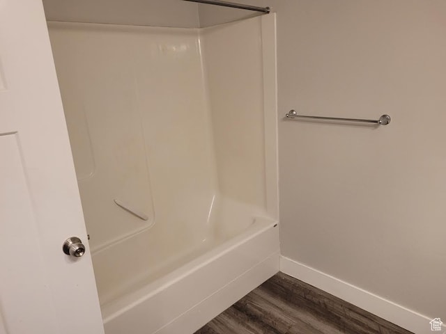 14474 Renner Ln Unit 302, Herriman, UT 84096 - bathroom featuring wood finished floors, baseboards, and bathtub / shower combination