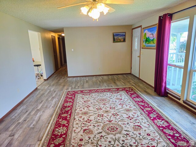 719 Adams St, Montpelier, ID 83254 - spare room with a ceiling fan, a textured ceiling, and wood finished floors