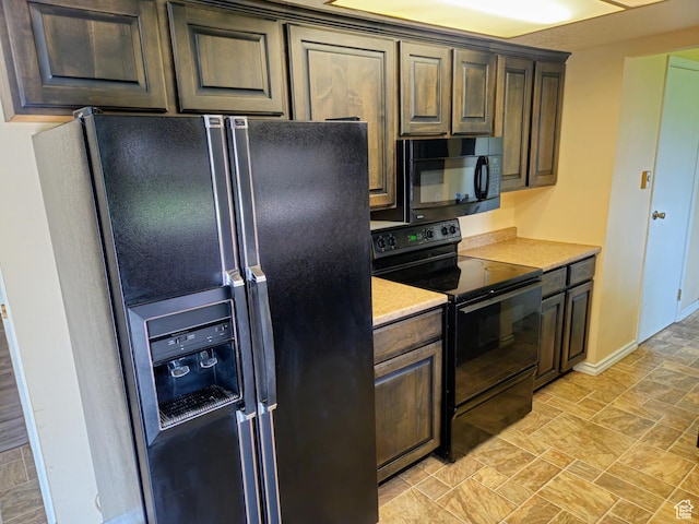 719 Adams St, Montpelier, ID 83254 - kitchen featuring black appliances, light countertops, and dark brown cabinetry