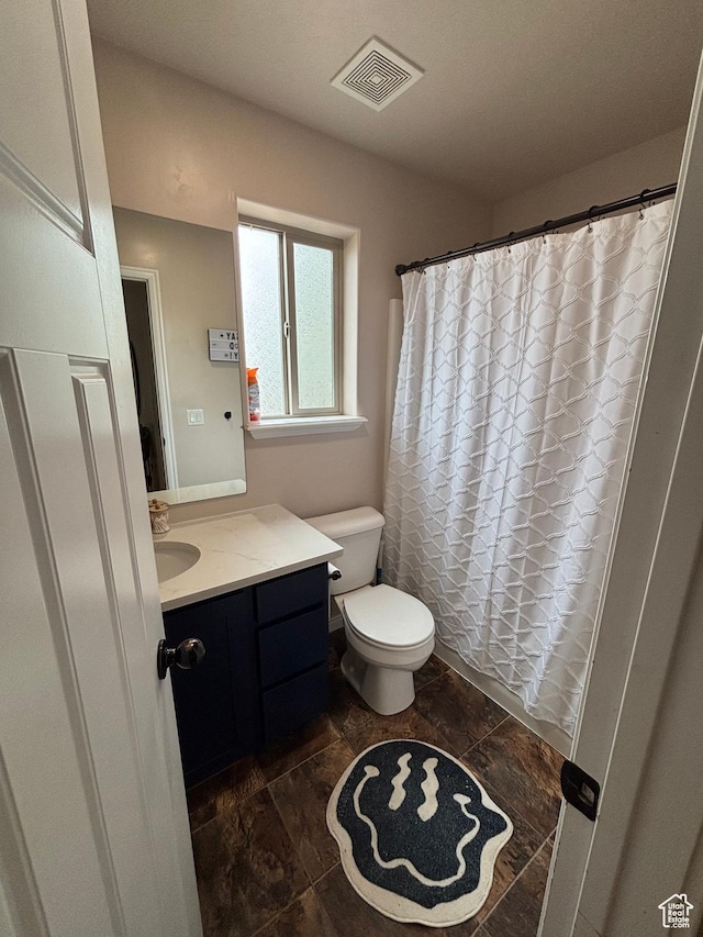 1574 S 2000 E, Vernal, UT 84078 - bathroom featuring vanity, toilet, and a shower with curtain