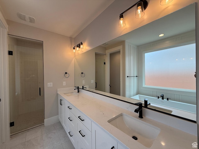 2863 E Freshet Dr, Washington, UT 84780 - full bath featuring double vanity, a stall shower, tile patterned floors, and baseboards