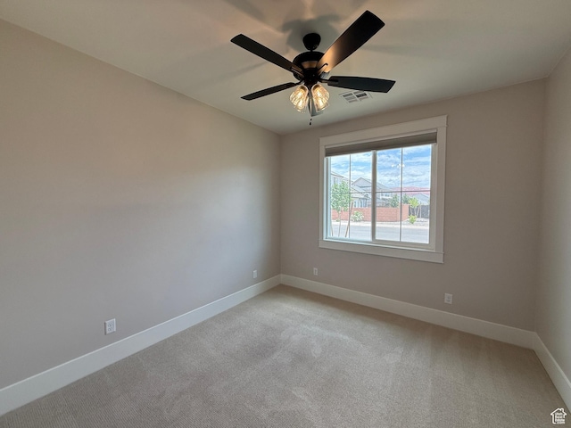 2863 E Freshet Dr, Washington, UT 84780 - empty room featuring baseboards, light colored carpet, and a ceiling fan