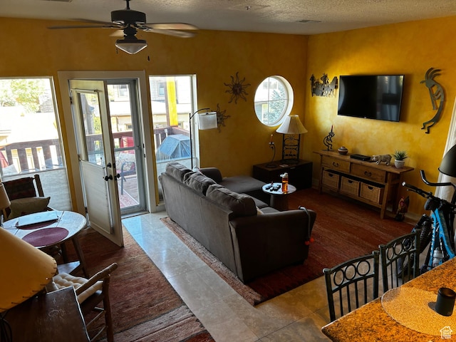 5420 N Bobsled Blvd Unit 202, Park City, UT 84098 - tiled living area with a textured ceiling and a ceiling fan