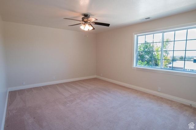 1814 N Heather Dr, Orem, UT 84097 - spare room featuring a ceiling fan, light carpet, and baseboards