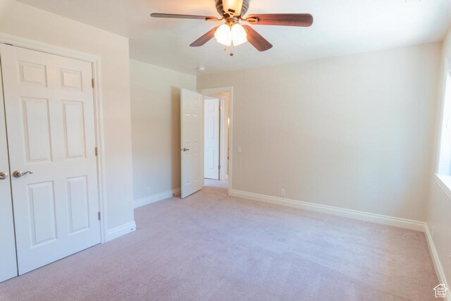 1814 N Heather Dr, Orem, UT 84097 - unfurnished bedroom with light carpet, baseboards, and a ceiling fan