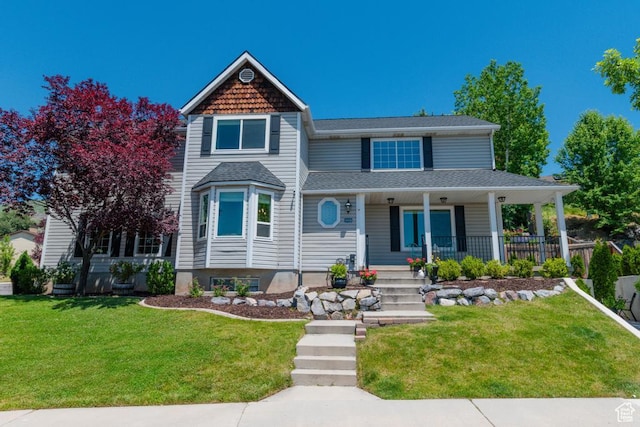 1814 N Heather Dr, Orem, UT 84097 - victorian house with covered porch, a front yard, and a shingled roof