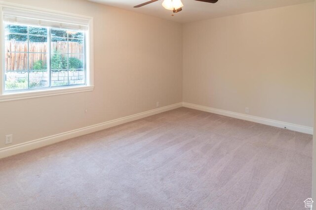 1814 N Heather Dr, Orem, UT 84097 - spare room with a ceiling fan, light carpet, and baseboards