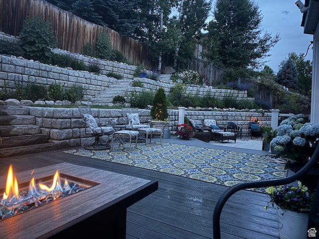1814 N Heather Dr, Orem, UT 84097 - wooden terrace featuring a fenced backyard and an outdoor living space with a fire pit