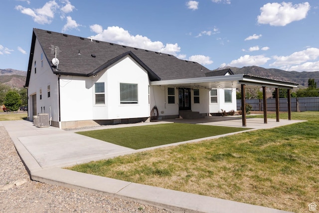 425 W 1080 S, Monroe, UT 84754 - rear view of property featuring a mountain view, a patio, roof with shingles, and central air condition unit
