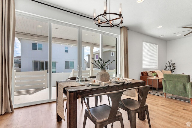 1797 N Avocet Dr, Salem, UT 84653 - dining area featuring light wood finished floors, a chandelier, plenty of natural light, and recessed lighting