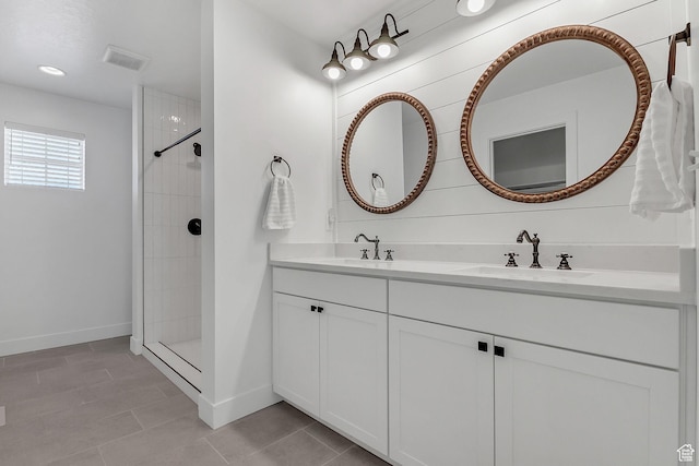 1797 N Avocet Dr, Salem, UT 84653 - bathroom with double vanity, a tile shower, baseboards, and tile patterned floors