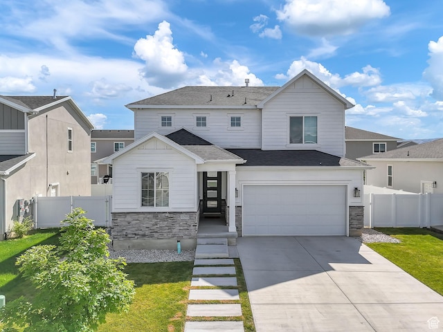 1797 N Avocet Dr, Salem, UT 84653 - view of front of home featuring stone siding, a garage, concrete driveway, and a shingled roof