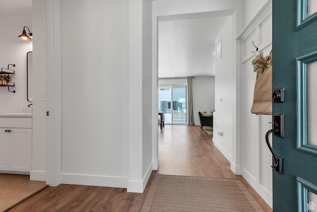 1797 N Avocet Dr, Salem, UT 84653 - corridor featuring wood finished floors, baseboards, and a sink
