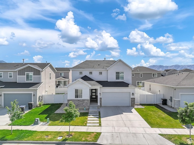 1797 N Avocet Dr, Salem, UT 84653 - view of front of home featuring a residential view, driveway, stone siding, and a garage