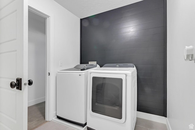 1797 N Avocet Dr, Salem, UT 84653 - laundry area with independent washer and dryer, baseboards, light tile patterned floors, and wood walls