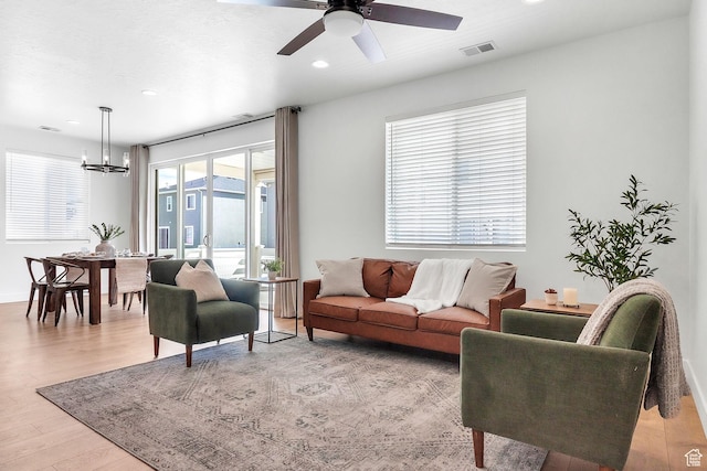 1797 N Avocet Dr, Salem, UT 84653 - living room featuring a chandelier, recessed lighting, light wood finished floors, and ceiling fan