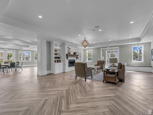 10486 S Harvest Glory Dr W Unit 125, South Jordan, UT 84095 - living area with a large fireplace, a chandelier, plenty of natural light, baseboards, and recessed lighting