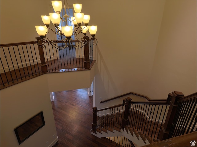 2307 Maple Leaf Dr, Cove, UT 84320 - staircase featuring a chandelier and wood finished floors