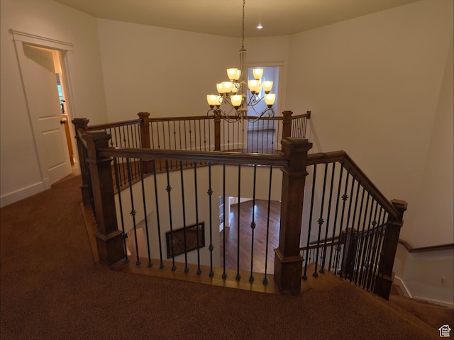 2307 Maple Leaf Dr, Cove, UT 84320 - stairs featuring a chandelier, carpet, and baseboards