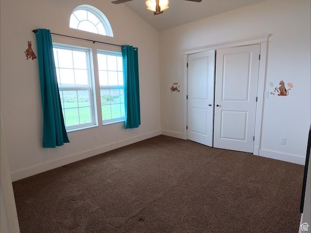 2307 Maple Leaf Dr, Cove, UT 84320 - unfurnished bedroom featuring dark carpet, multiple windows, vaulted ceiling, and baseboards