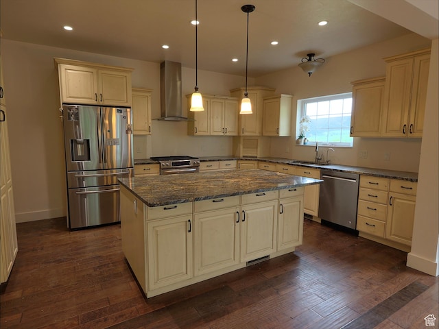 2307 Maple Leaf Dr, Cove, UT 84320 - kitchen featuring stainless steel appliances, wall chimney range hood, recessed lighting, a center island, and dark stone countertops