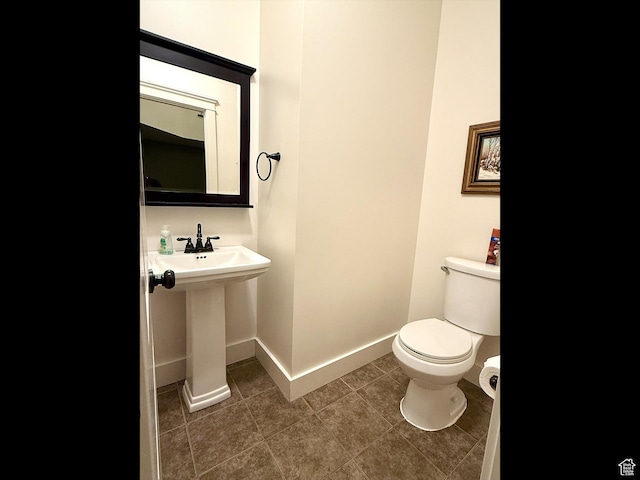 2307 Maple Leaf Dr, Cove, UT 84320 - half bath featuring toilet and tile patterned floors
