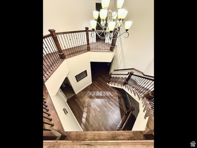 2307 Maple Leaf Dr, Cove, UT 84320 - stairway featuring a chandelier and wood finished floors