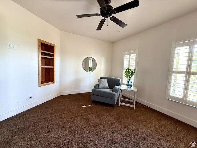 2307 Maple Leaf Dr, Cove, UT 84320 - sitting room featuring healthy amount of natural light, dark carpet, a ceiling fan, and built in features