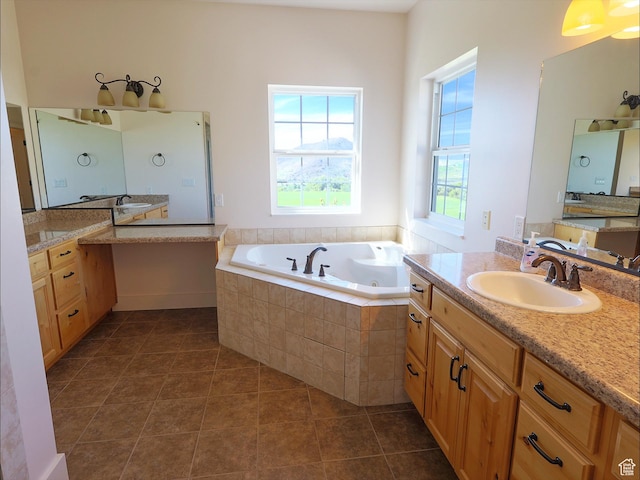 2307 Maple Leaf Dr, Cove, UT 84320 - bathroom with a jetted tub, two vanities, and tile patterned flooring