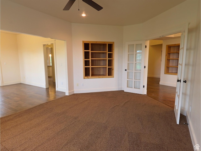 2307 Maple Leaf Dr, Cove, UT 84320 - empty room featuring dark colored carpet, french doors, ceiling fan, baseboards, and dark wood-style floors