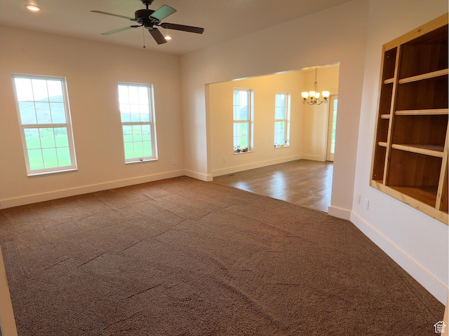 2307 Maple Leaf Dr, Cove, UT 84320 - unfurnished room featuring dark colored carpet, a chandelier, plenty of natural light, a ceiling fan, and recessed lighting