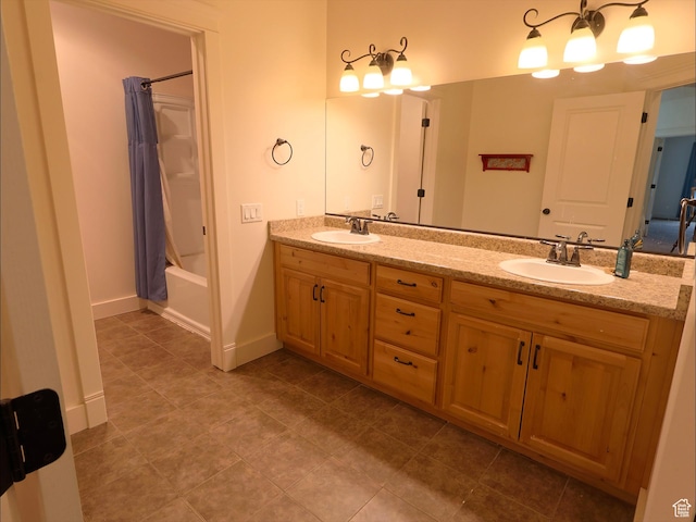 2307 Maple Leaf Dr, Cove, UT 84320 - full bathroom featuring double vanity, tile patterned flooring, shower / tub combo, and baseboards