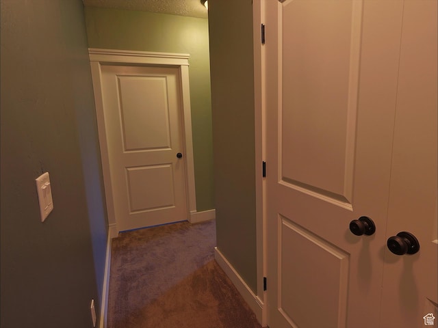 2307 Maple Leaf Dr, Cove, UT 84320 - hall featuring dark carpet and baseboards