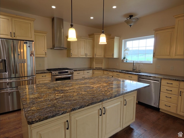 2307 Maple Leaf Dr, Cove, UT 84320 - kitchen with stainless steel appliances, wall chimney range hood, a sink, recessed lighting, and a kitchen island