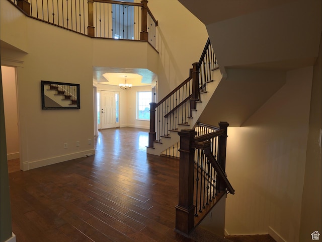 2307 Maple Leaf Dr, Cove, UT 84320 - foyer with a chandelier, wood finished floors, stairs, baseboards, and a high ceiling