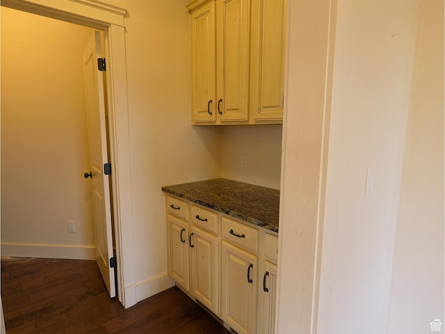 2307 Maple Leaf Dr, Cove, UT 84320 - kitchen with dark wood-style floors, baseboards, and dark stone counters