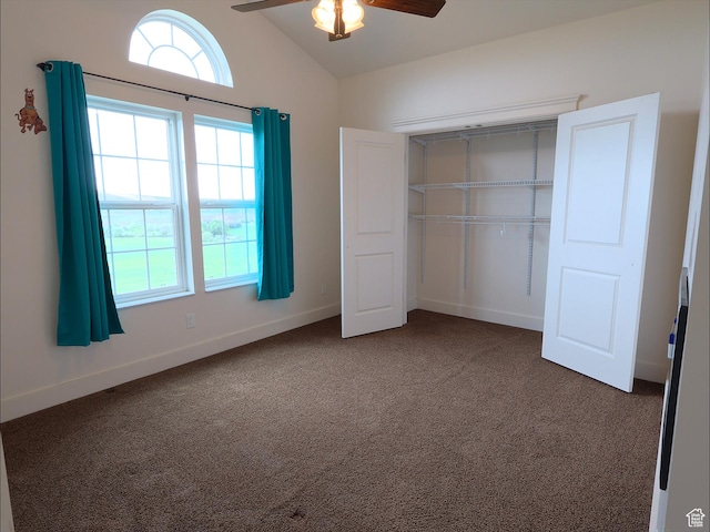 2307 Maple Leaf Dr, Cove, UT 84320 - unfurnished bedroom featuring dark carpet, multiple windows, vaulted ceiling, a closet, and baseboards