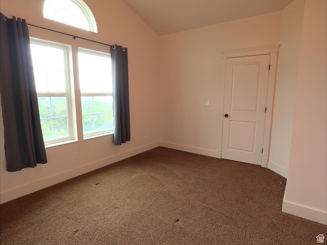 2307 Maple Leaf Dr, Cove, UT 84320 - empty room featuring carpet floors, lofted ceiling, healthy amount of natural light, and baseboards