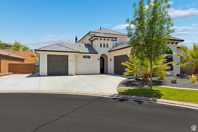 536 N Creek Cir, Washington, UT 84780 - view of front of house featuring an attached garage, driveway, stucco siding, and a tile roof
